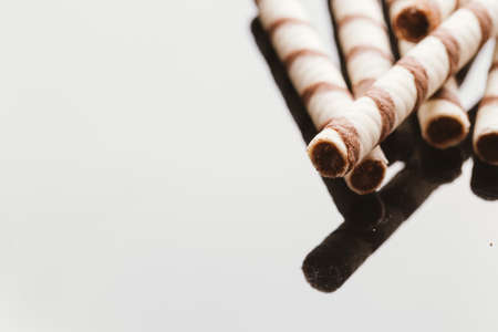 wafer rolls with nut filling on a mirrored background.の写真素材