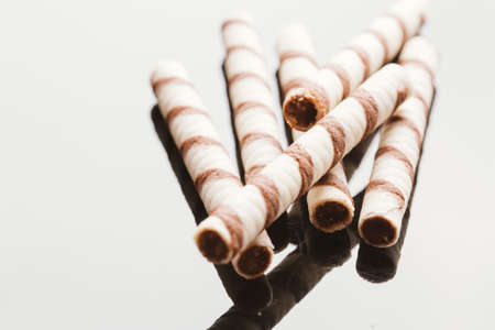 wafer rolls with nut filling on a mirrored background.の写真素材