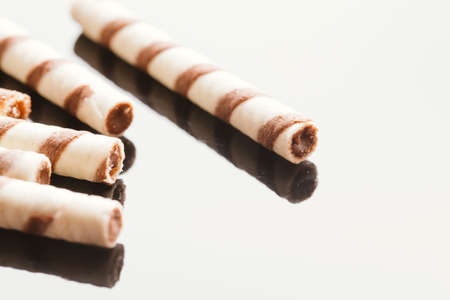 wafer rolls with nut filling on a mirrored background.の写真素材