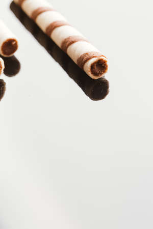 wafer rolls with nut filling on a mirrored background.の写真素材