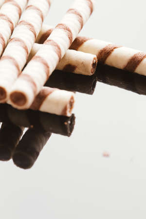 wafer rolls with nut filling on a mirrored background.の写真素材