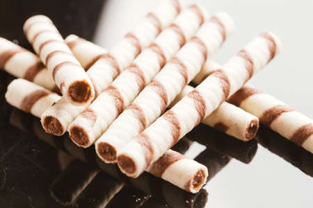 wafer rolls with nut filling on a mirrored background.の写真素材
