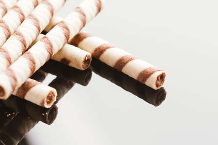 wafer rolls with nut filling on a mirrored background.の写真素材