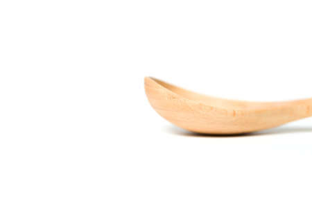 A wooden spoon isolated over white backgroundの写真素材