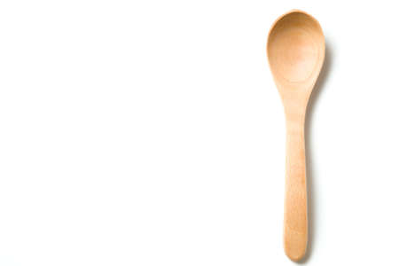A wooden spoon isolated over white backgroundの写真素材