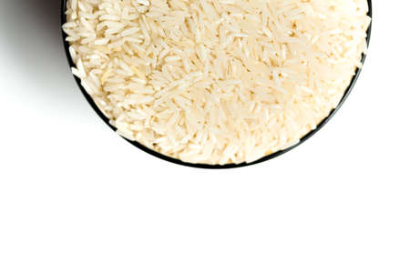 A rice in a bowl isolated over white backgroundの写真素材