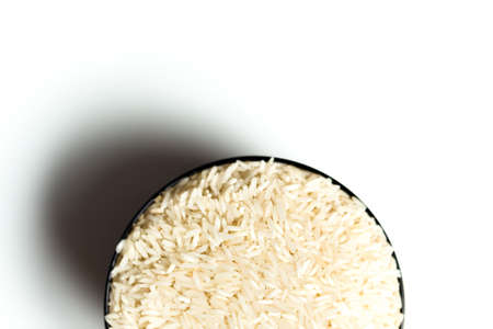 A rice in a bowl isolated over white backgroundの写真素材