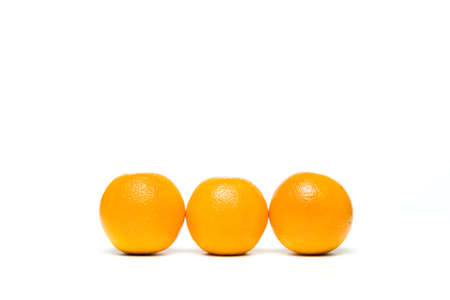 Fresh oranges fruit isolated over white backgroundの写真素材