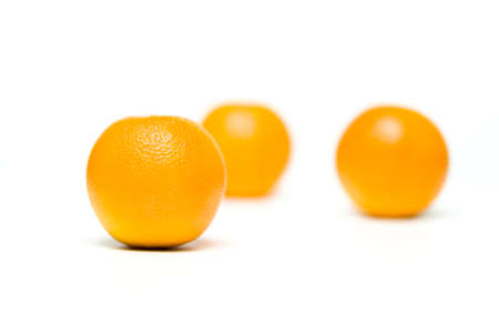 Fresh oranges fruit isolated over white backgroundの写真素材