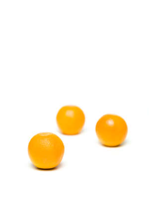 Fresh oranges fruit isolated over white backgroundの写真素材