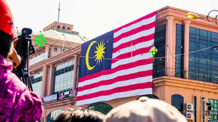 Malaysia flag and the Malaysian peopleのeditorial素材