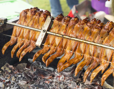 Tasty chicken wings in barbecue grill.の写真素材