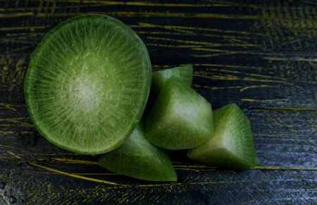 Green radish cut into piecesの写真素材
