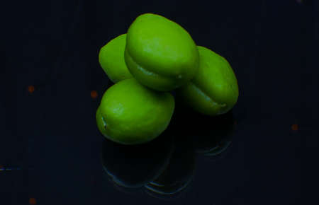 Unripe apricots, green in color, sourの写真素材