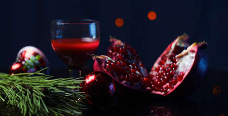 New Year, red pomegranate wine in a glassの写真素材