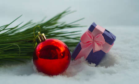 Red shiny toys in the white snowの写真素材