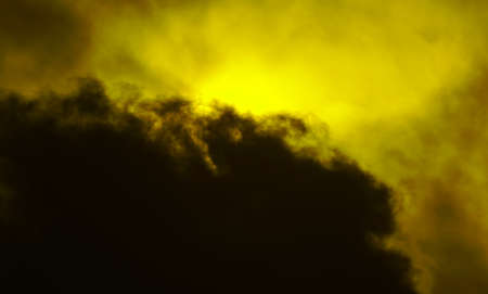 Cloudy weather, the sun is covered with black cloudsの写真素材