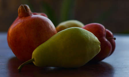 Apples, pears and pomegranates, a collection of different fruitsの写真素材