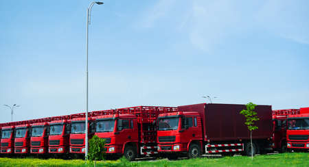 A number of large trucks lined upの写真素材