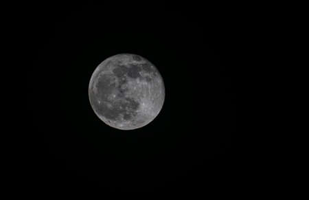 A close-up photo of the full moonの写真素材