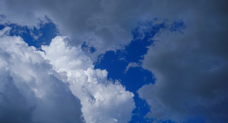 White clouds are scattered in the blue skyの写真素材