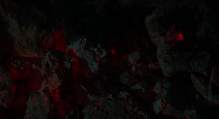 Coal is burning red in the darkの写真素材