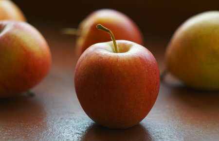 There is a red apple on the tableの写真素材