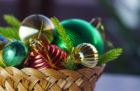 Christmas tree toys in a basket on the tableの写真素材