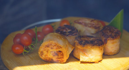 On the board there is a roulette wheel and tomatoesの写真素材