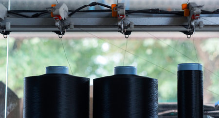 Threads on the loom become cloth
