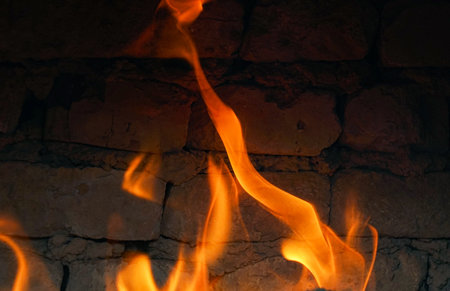 The fire burns red in the hearth