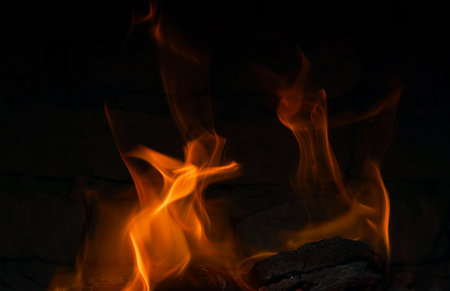The fire burns red in the hearth