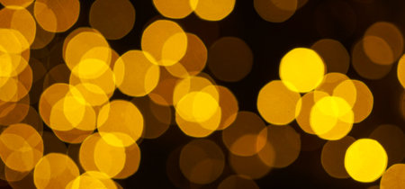 Photo of holiday lights lit in different colorsの写真素材