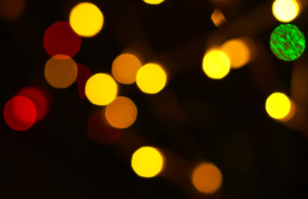 Photo of holiday lights lit in different colors