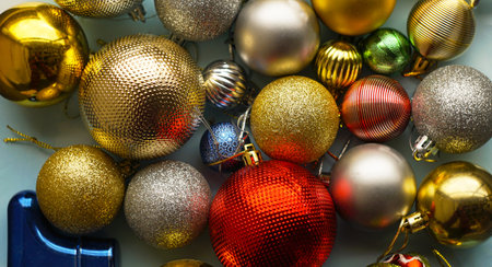 Various Christmas tree toys are scattered on a white backgroundの写真素材