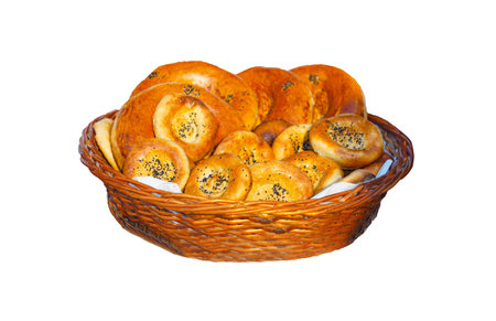 Freshly baked bread in a basket on a white backgroundの写真素材