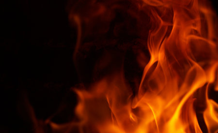 The appearance of a burning red flame on a black background