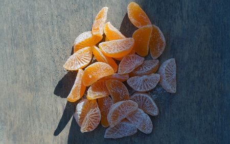 Dried tangerine kernels stand in a ball on a board