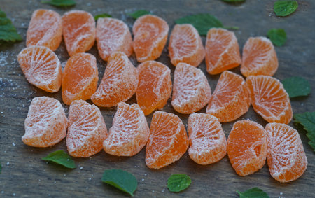 Dried tangerine slices on a boardの写真素材