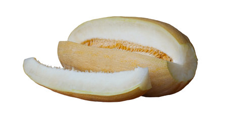 A large yellow melon cut into pieces on a white backgroundの写真素材