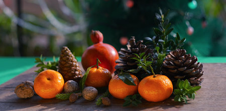 Tangerines and fir nuts on the table. New Year's table