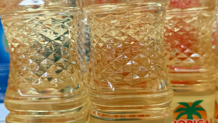 Close-up shot of a row of transparent glass bottles.