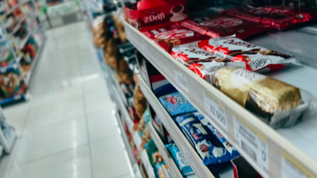 Jakarta, Indonesia - Februari 1, 2026: Pharmacy retail shelf displaying over-the-counter medicine, baby care, vitamins, and health products in a modern Indonesian drugstoreのeditorial素材
