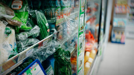 Jakarta, Indonesia - Februari 1, 2026: Pharmacy retail shelf displaying over-the-counter medicine, baby care, vitamins, and health products in a modern Indonesian drugstoreのeditorial素材