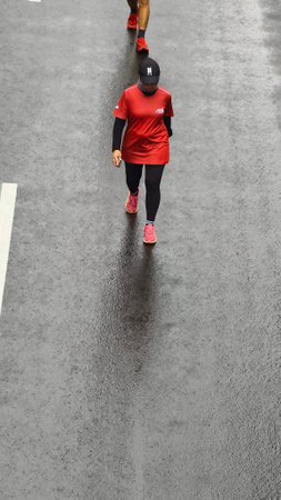 Jakarta, Indonesia - Februari 1, 2026: People running and jogging during Car Free Day event at Sudirman street, showing healthy lifestyle, urban fitness activity, and active communのeditorial素材