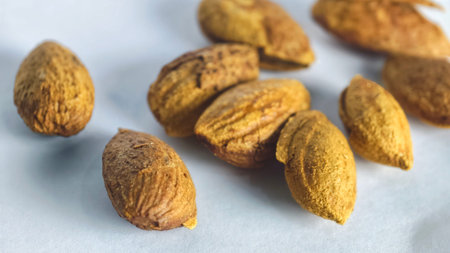 Organic raw almond nuts close up macro healthy food texture background high detail natural nutrition ingredient for snack diet and wellness conceptの写真素材