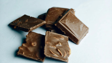 Rich chocolate bar close up showing creamy layers and smooth texture, highlighting delicious dessert detail.の写真素材