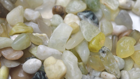 Natural green pebble stones texture background with organic mineral colors and smooth small rocks...