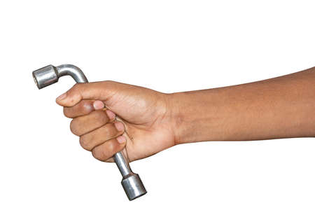 Hand of car mechanic with a wrench. Isolated over white background