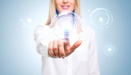 Businesswoman on blurred background using digital interface with hologram projection 3D renderingの素材